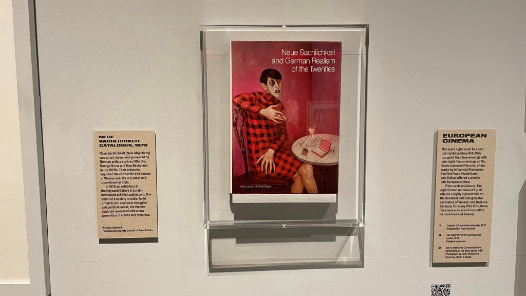 Exhibition display featuring the cover of 'Neue Sachlichkeit and German Realism of the Twenties' alongside informational panels about the Neue Sachlichkeit movement and European cinema.